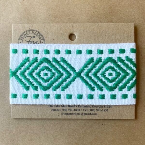 A Sonora Tapes 2 1/4 IN embroidered ribbon on a card.
