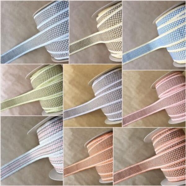 A collection of different colors of Camlet and Camlet Wool 2.25 ribbon.