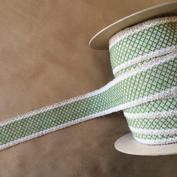 Green and white Camlet and Camlet Wool 2.25 ribbon.