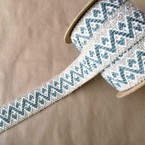 A roll of Chevron Wool embroidered ribbon.