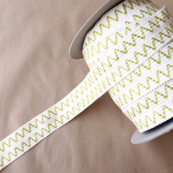 An Essex 2IN roll of green and yellow chevron ribbon.