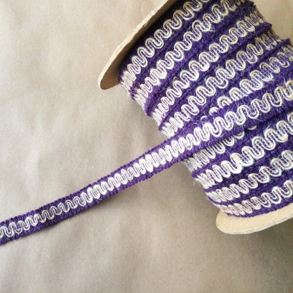 A spool of G-12 Gimps lace ribbon.