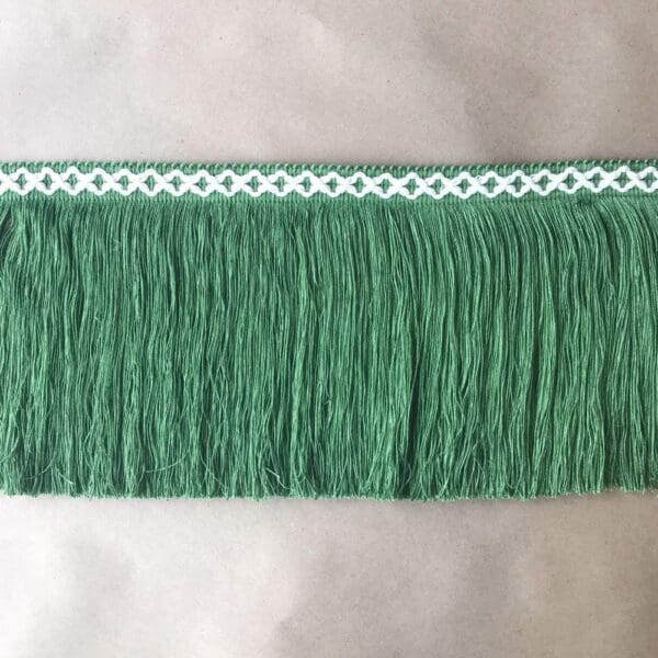 A green fringe on a white background.