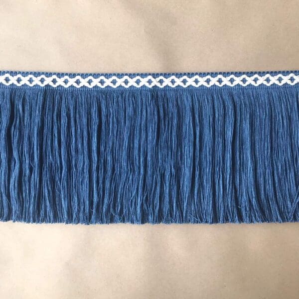 A blue fringe with white trim on it.