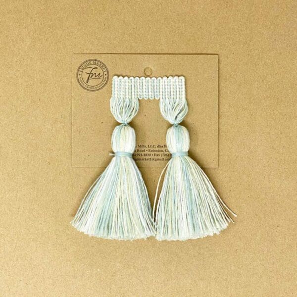 Two 5IN Chunky Tassels on a brown background.