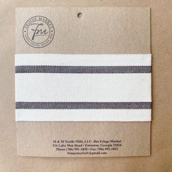 A white and black stripe on a piece of paper.