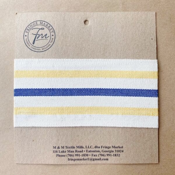 A yellow and blue striped bandana on a piece of paper.
