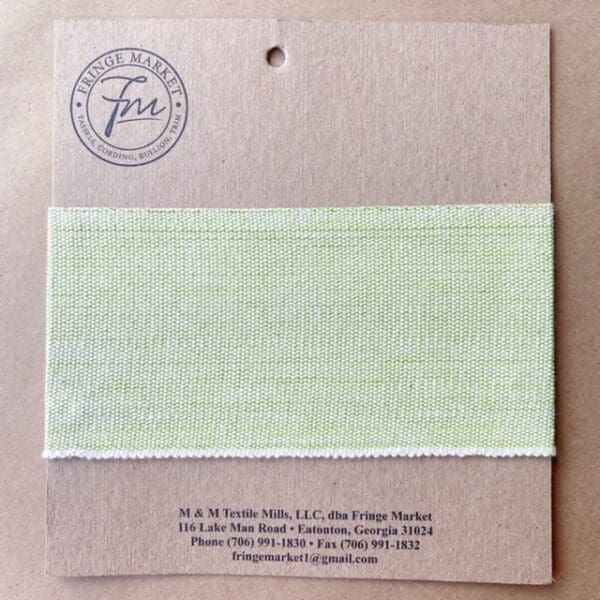 A piece of green fabric with a label on it.