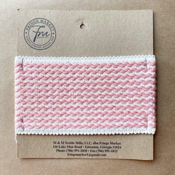 A pink and white braided Barnsley 3 3/4 IN Tapes in a package.
