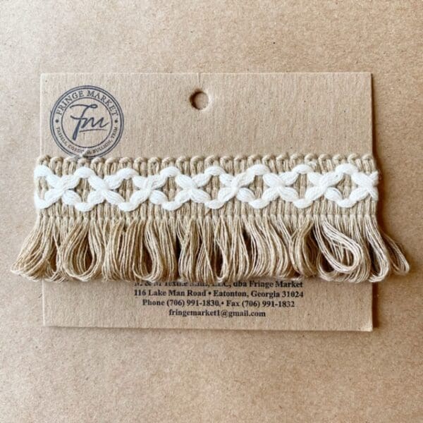 A card with a Loopy Fringe 1.5 IN tassel on it.