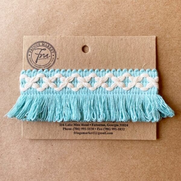 A Loopy Fringe 1.5 IN tassel on a card.