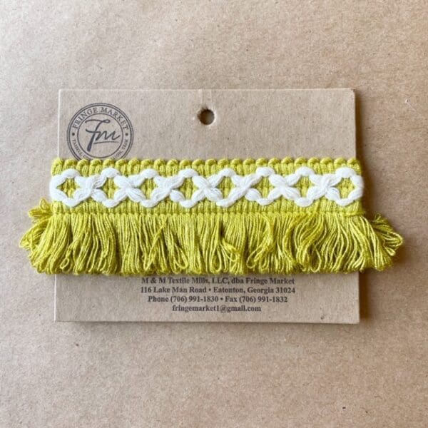 A Loopy Fringe 1.5 IN tassel on a card.