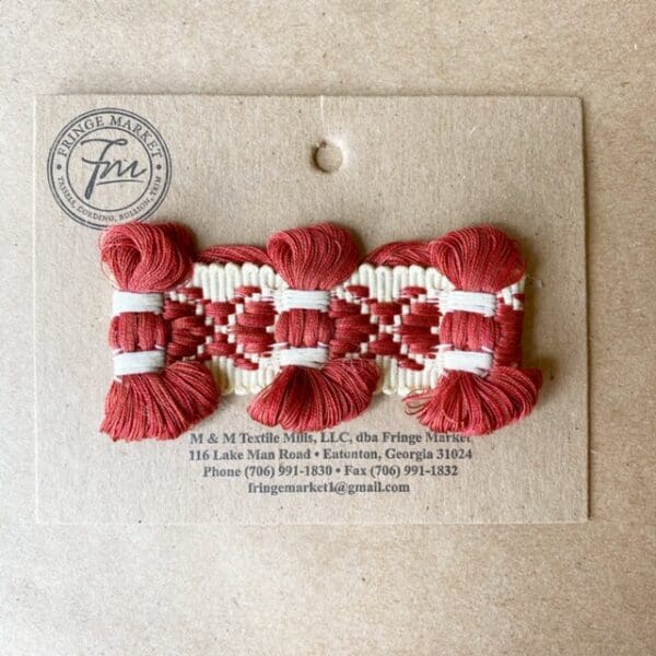 A red and white Bow Tie Braid 1 3/4 IN on a card.