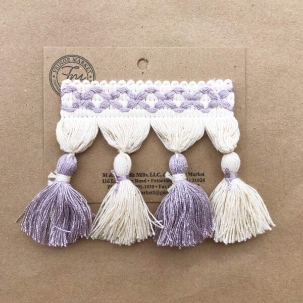 Lavender and white Frills Tassel Fringe 3.5 IN on a piece of paper.