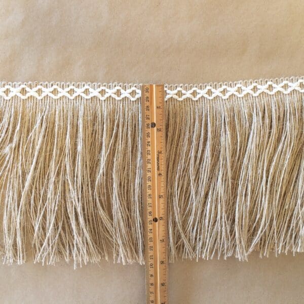 A Jute 8IN Diamond Fringe with fringes on it.