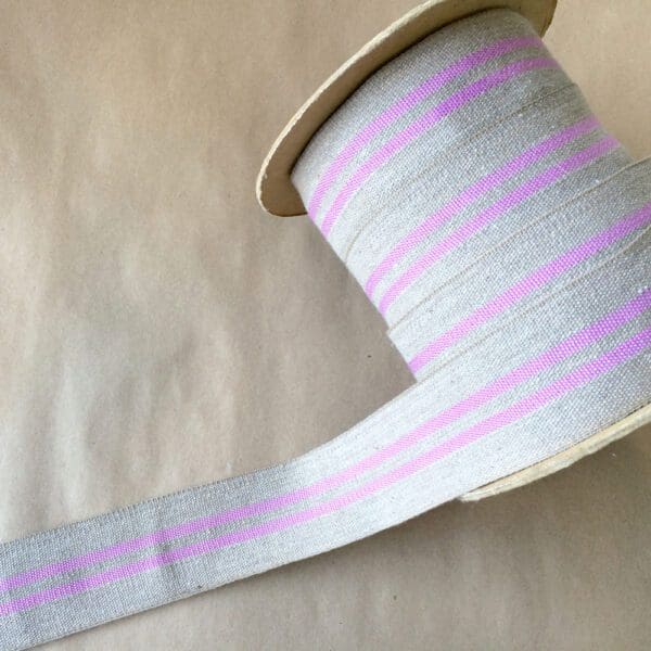 A spool of Modern Grain Sack striped ribbon.