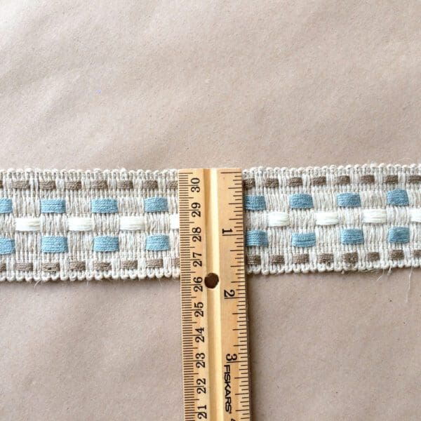 A Rio Braids with a ruler on it.
