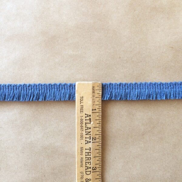 A ruler next to a piece of Sef-Selvedge Edge Fringe.