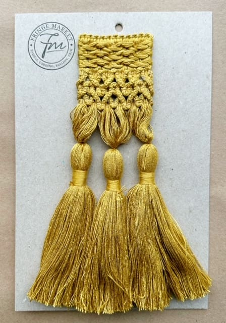 A Bijoux Tassel Fringes 9in & 11in on a piece of paper.