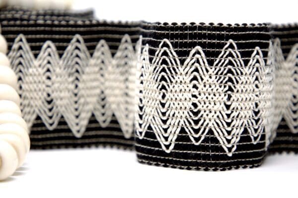 A Modish 3in woven belt with white beads.