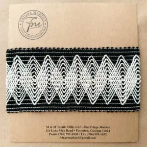 A black and white Modish 3in braided headband.