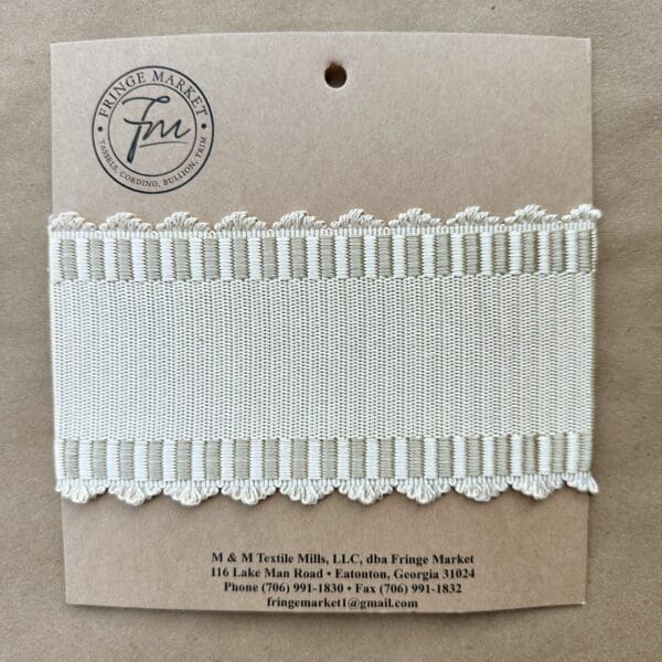 A Madison Ave 3.5 in Silk Tape lace trim in a package.