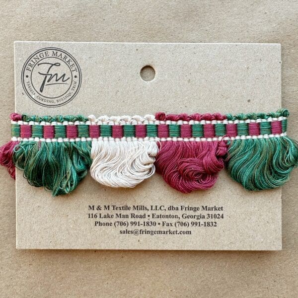Lenox Loop Fringe in green, red and white on a card.