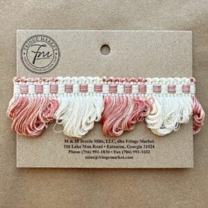 A Lenox Loop Fringe card with pink and white tassels on it.