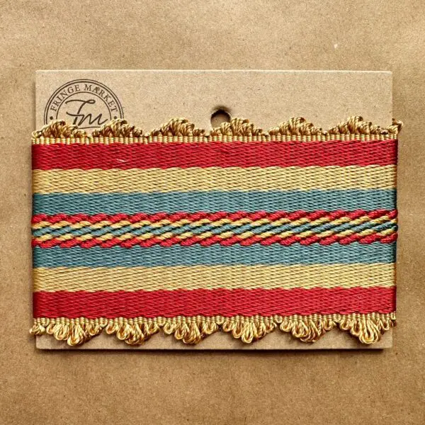 A red, blue and yellow striped Gramercy Silk Braids on a brown background.