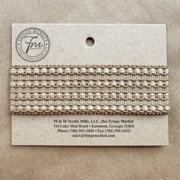A card with a Hudson Braids ribbon on it.