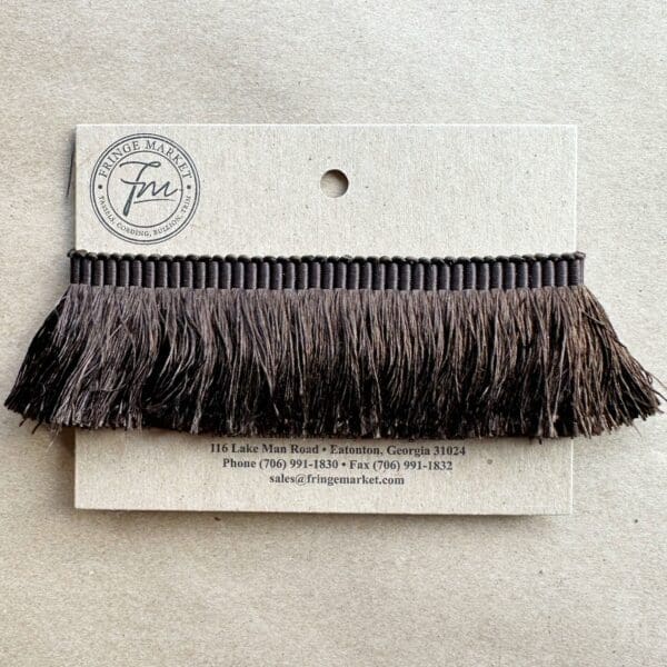 A Silk 100% Cut Brush Fringe 1.5in with a brown fringe on it.