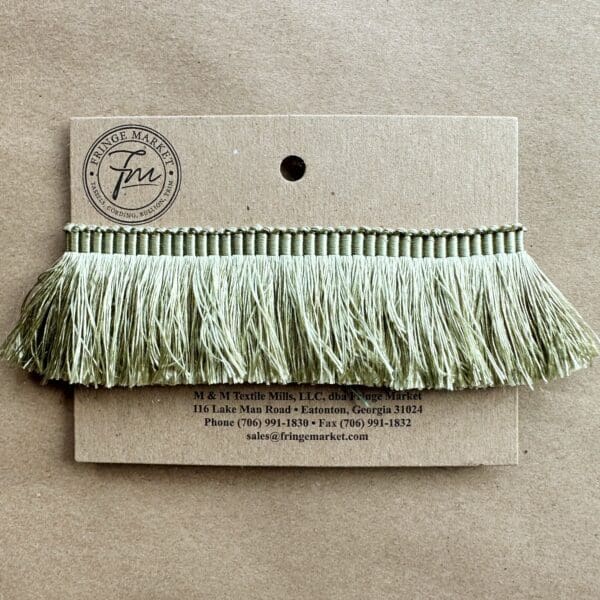 A Silk 100% Cut Brush Fringe 1.5in on a piece of paper.