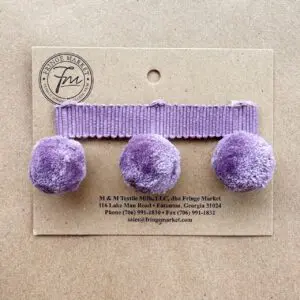 Three purple Polly Pom Pom 1in hair clips mounted on a cardboard tag with the Fringe Market brand information.