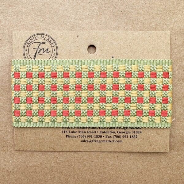 Tabby Braid 2in ribbon with a green and red checkered pattern attached to a cardboard label displaying contact information.